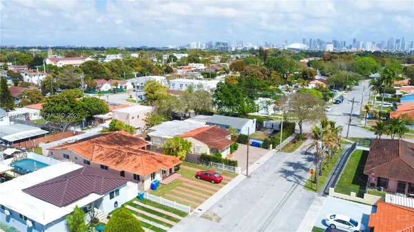 an aerial view of residential houses with outdoor space