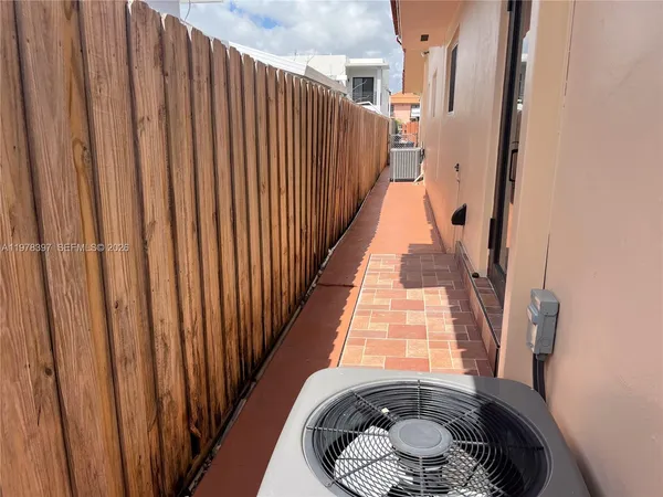 a view of balcony with wooden floor