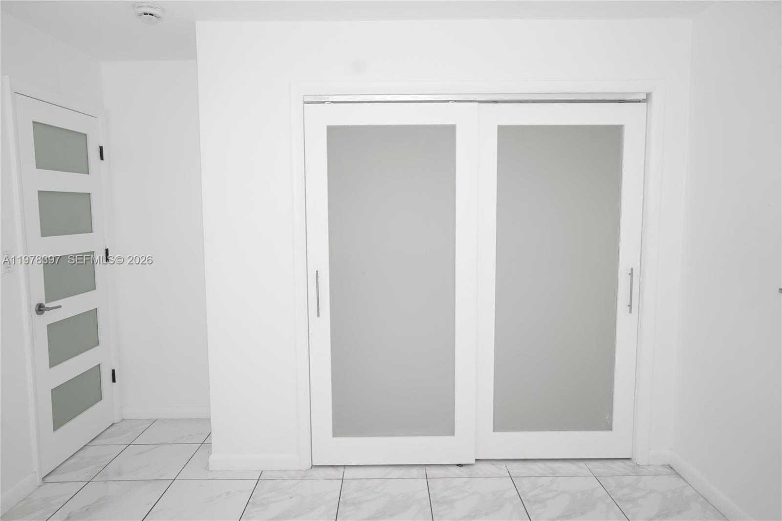 3423 Southwest 3rd Street, Unit 1 Miami, FL 33135 - Photo 8 of 18 a view of an empty walk in closet