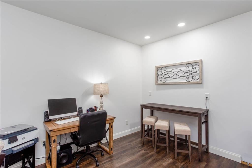 3445 Vinson Mountain Road Rockmart, GA 30153 - Photo 11 of 40 a workspace with furniture and wooden floor