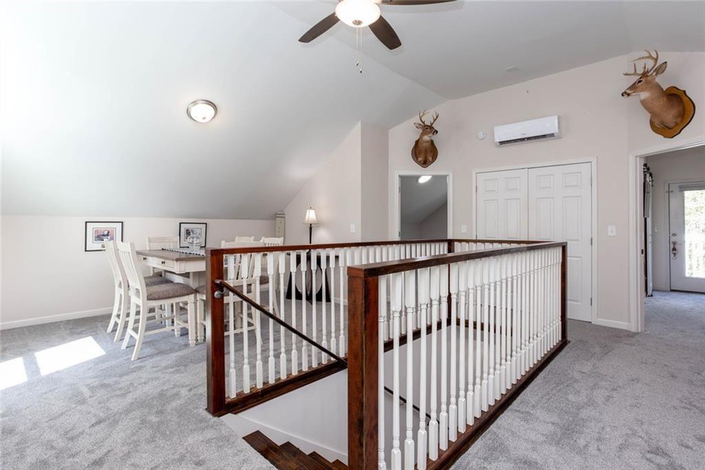 3445 Vinson Mountain Road Rockmart, GA 30153 - Photo 19 of 40 a view of a hallway with a hanging ceiling fan