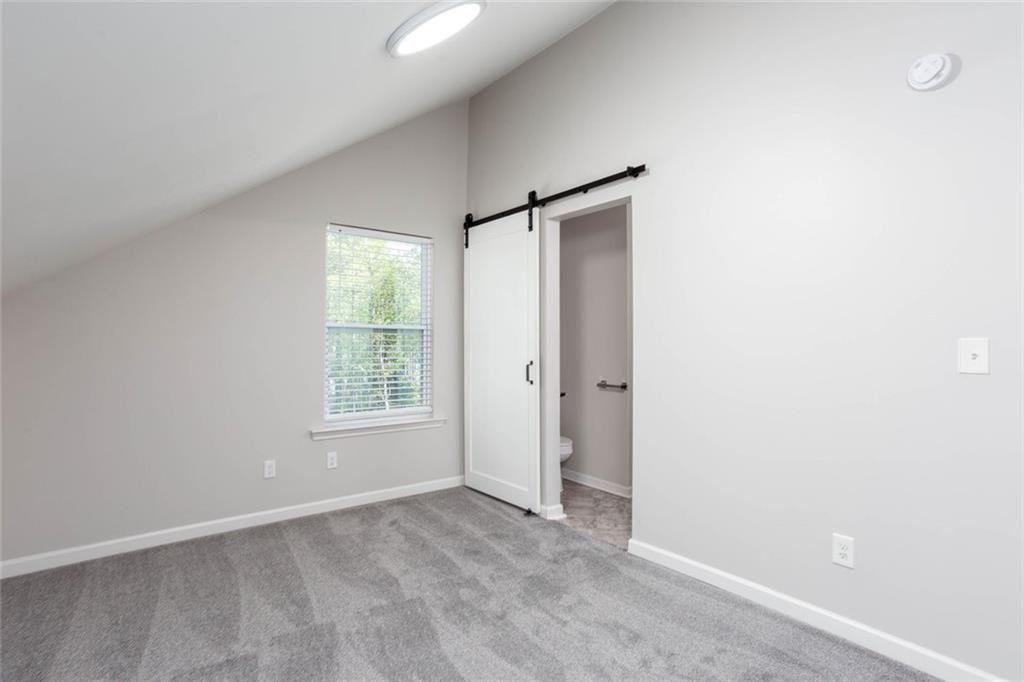 3445 Vinson Mountain Road Rockmart, GA 30153 - Photo 22 of 40 a view of an empty room with a window