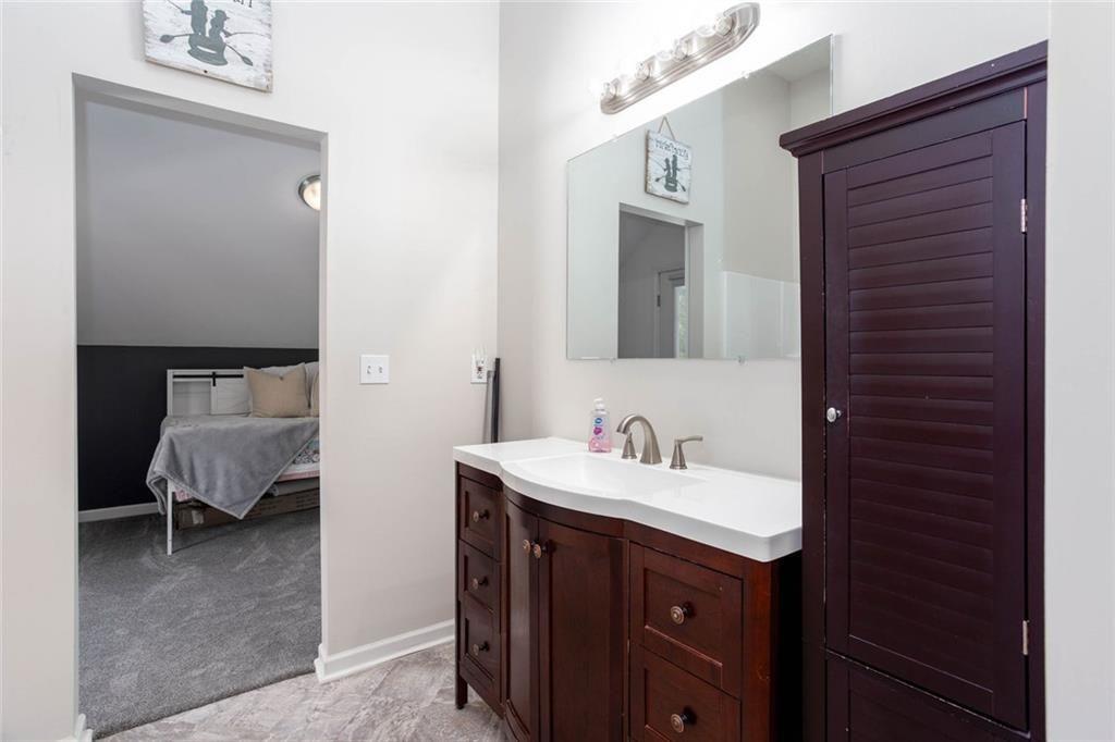 3445 Vinson Mountain Road Rockmart, GA 30153 - Photo 24 of 40 a en suite bathroom with a sink and a mirror