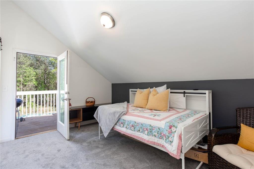 3445 Vinson Mountain Road Rockmart, GA 30153 - Photo 26 of 40 a bedroom with a bed and a table
