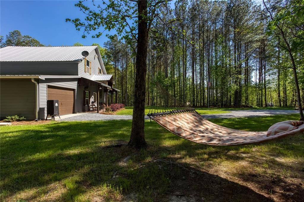 3445 Vinson Mountain Road Rockmart, GA 30153 - Photo 31 of 40 a view of a house with a yard
