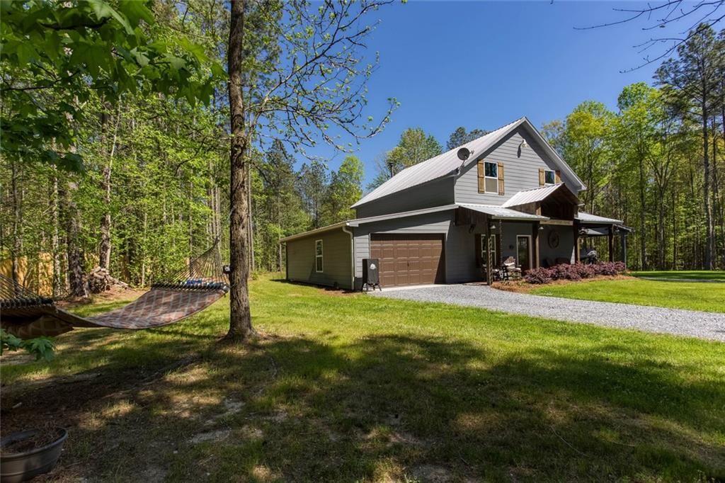 3445 Vinson Mountain Road Rockmart, GA 30153 - Photo 32 of 40 a front view of a house with a garden