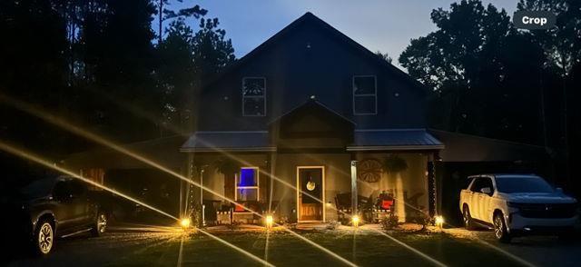 3445 Vinson Mountain Road Rockmart, GA 30153 - Photo 38 of 40 a view of a house with gym equipment and floor to ceiling window and tree