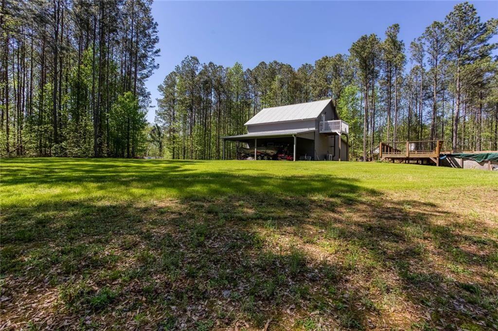3445 Vinson Mountain Road Rockmart, GA 30153 - Photo 5 of 40 a front view of a house with a yard