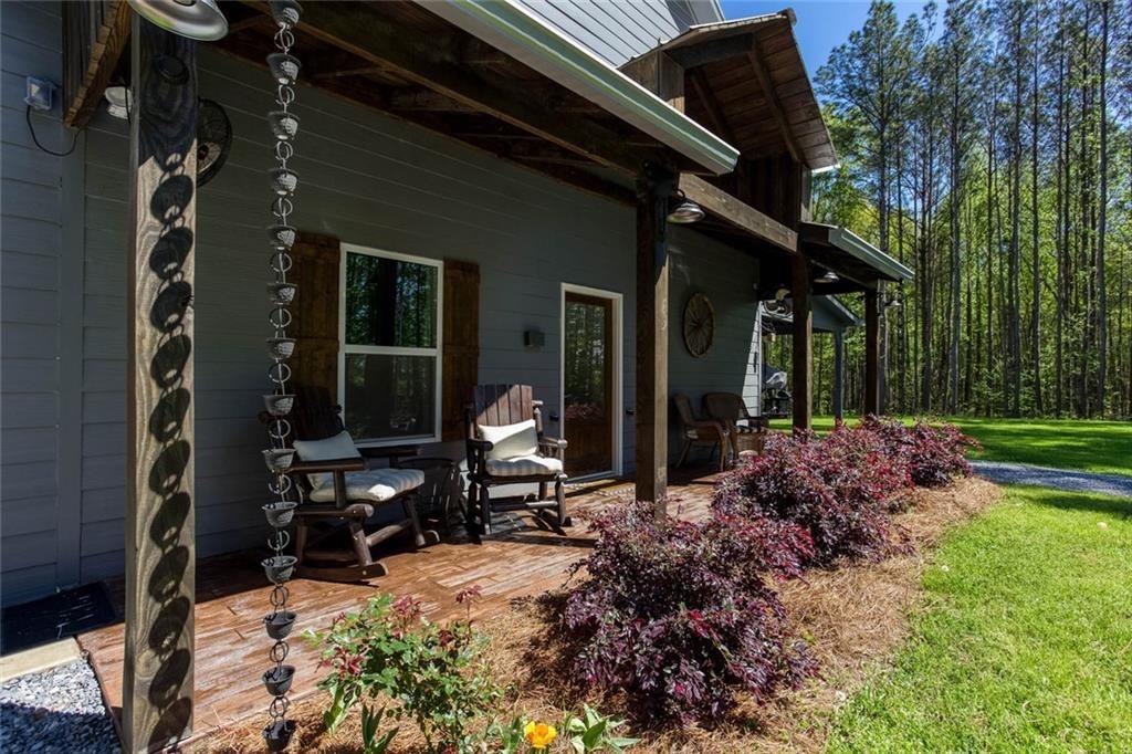3445 Vinson Mountain Road Rockmart, GA 30153 - Photo 6 of 40 a view of house with backyard outdoor seating and garden