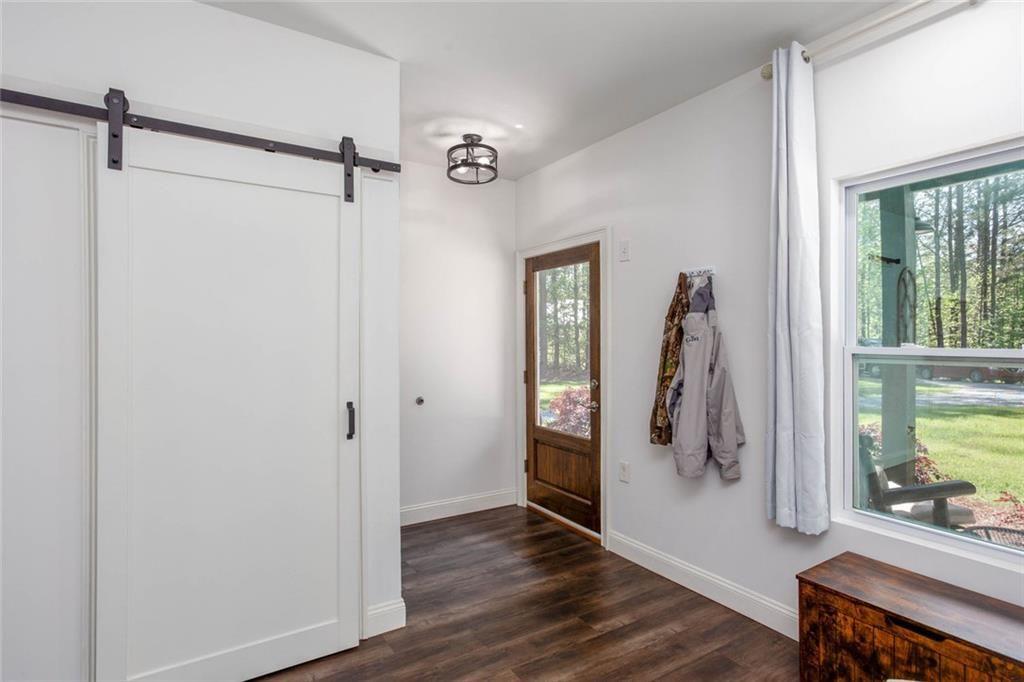 3445 Vinson Mountain Road Rockmart, GA 30153 - Photo 7 of 40 a view of walk in closet with window and wooden floor