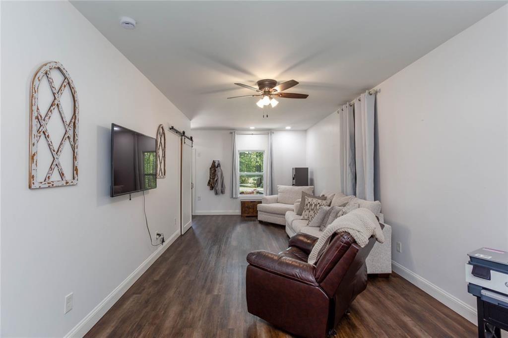 3445 Vinson Mountain Road Rockmart, GA 30153 - Photo 10 of 40 a living room with furniture and a flat screen tv