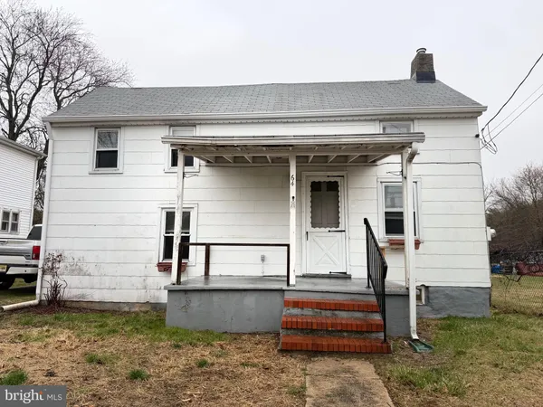a front view of house with stairs
