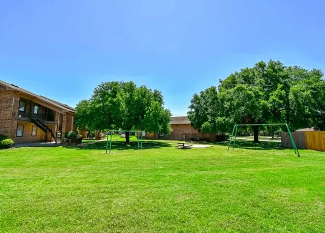 a view of a park with plants and trees