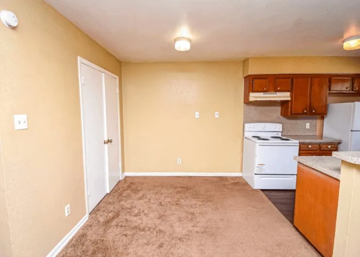 1845 5th Street Hempstead, TX 77445 - Photo 9 of 10 a view of a kitchen with white cabinets and wooden floor