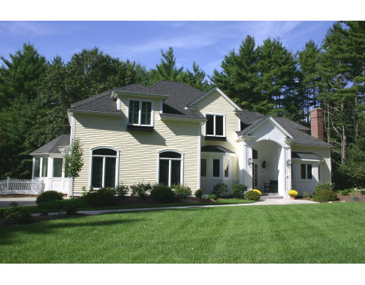 28 Moore Road Sudbury, MA 01776 - Photo 1 of 21 a front view of a house with a yard