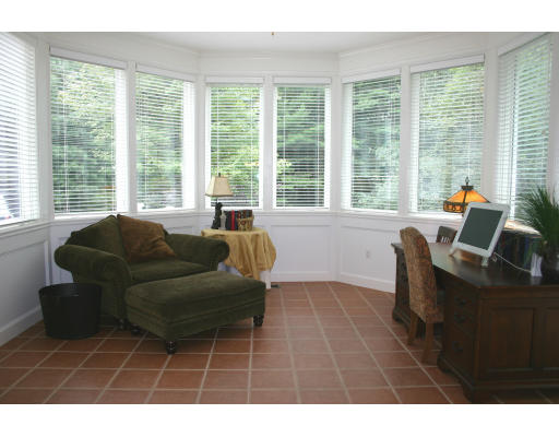 28 Moore Road Sudbury, MA 01776 - Photo 12 of 21 a living room with furniture and a large window
