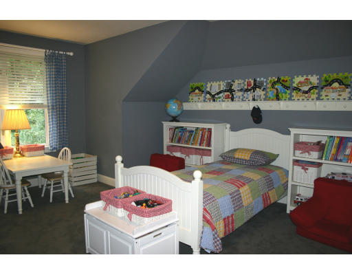 28 Moore Road Sudbury, MA 01776 - Photo 18 of 21 a bedroom with a bed and a table