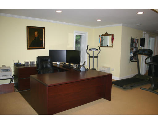 28 Moore Road Sudbury, MA 01776 - Photo 19 of 21 a living room with furniture and a flat screen tv