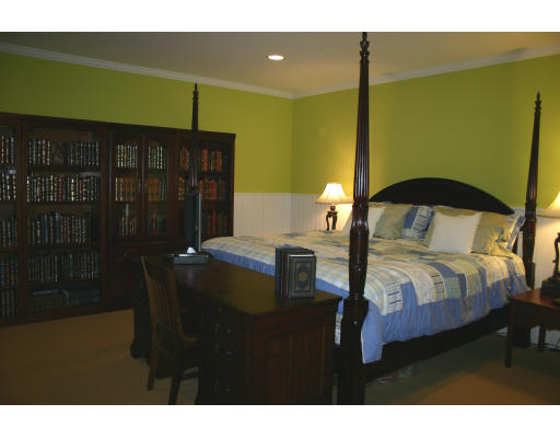28 Moore Road Sudbury, MA 01776 - Photo 20 of 21 a bedroom with a bed table and window