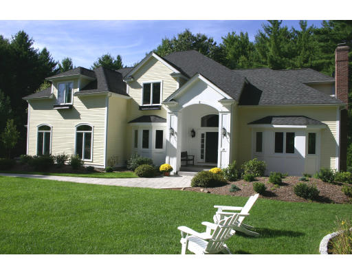 28 Moore Road Sudbury, MA 01776 - Photo 2 of 21 a front view of a house with a yard