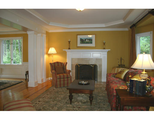 28 Moore Road Sudbury, MA 01776 - Photo 5 of 21 a living room with furniture and a fireplace
