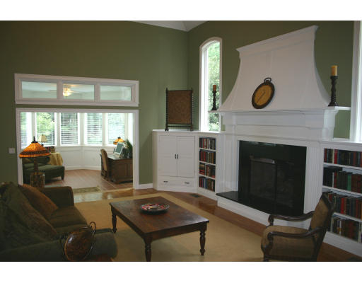 28 Moore Road Sudbury, MA 01776 - Photo 9 of 21 a living room with furniture and a fireplace