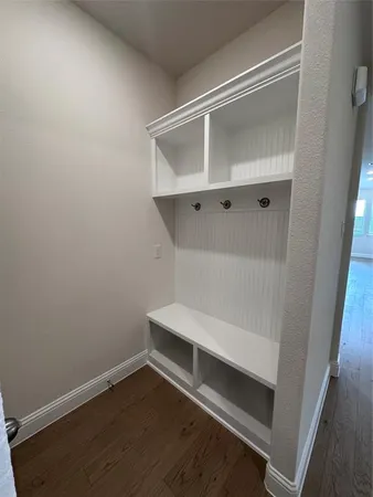 an empty room with wooden floor