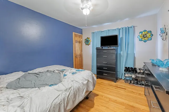 a bedroom with a bed and a tv