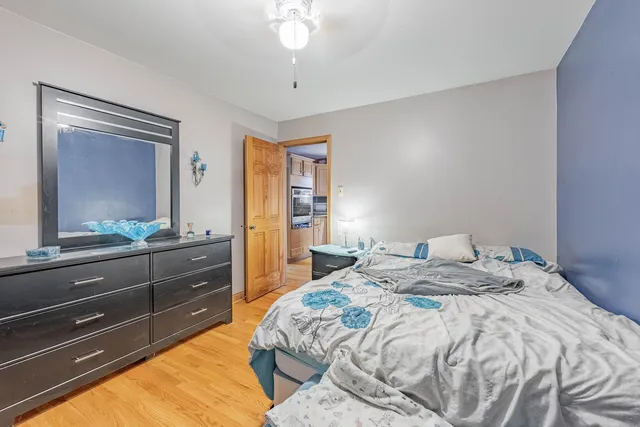 a bedroom with a bed and a dresser