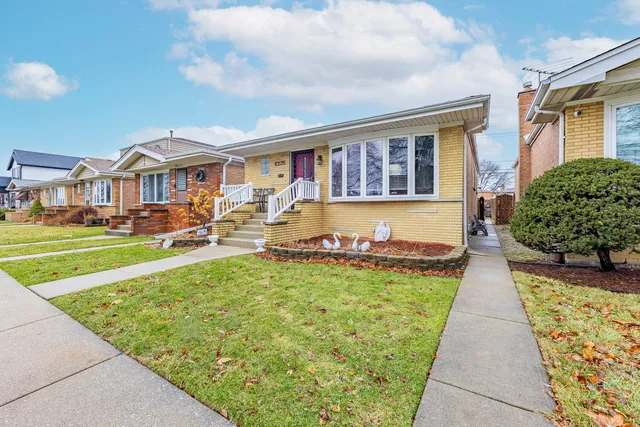 a front view of a house with swimming pool having outdoor seating