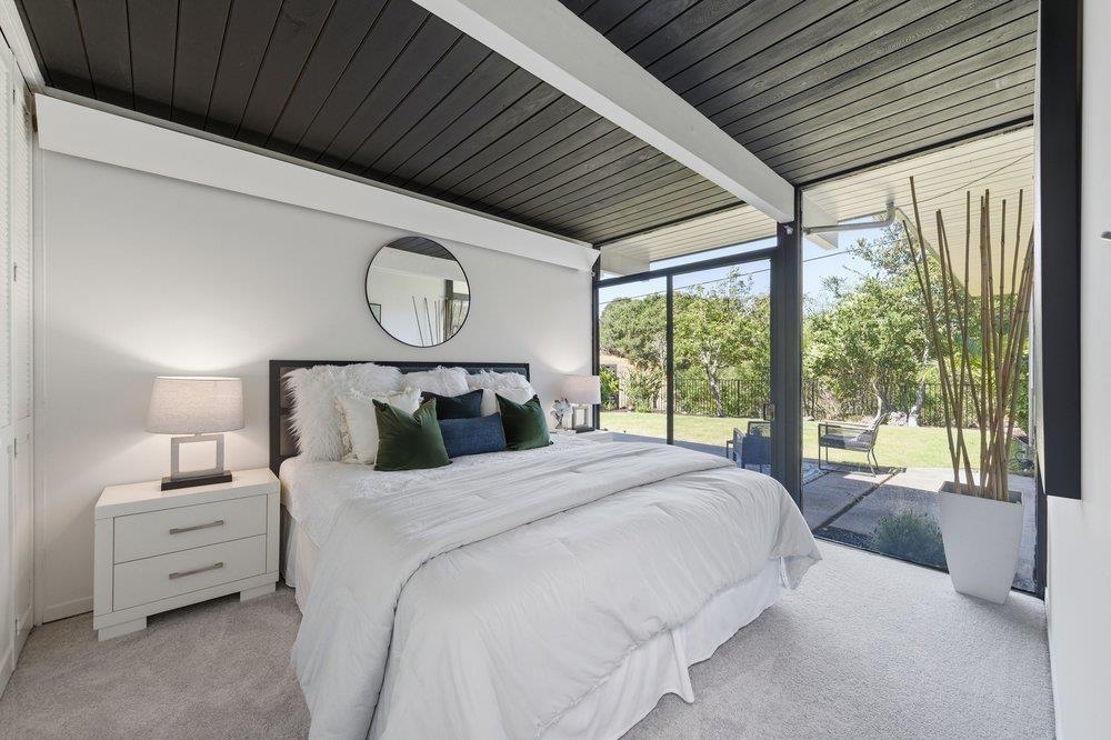 2203 Allegheny Way San Mateo, CA 94402 - Photo 18 of 56 a bedroom with a large bed and a large window