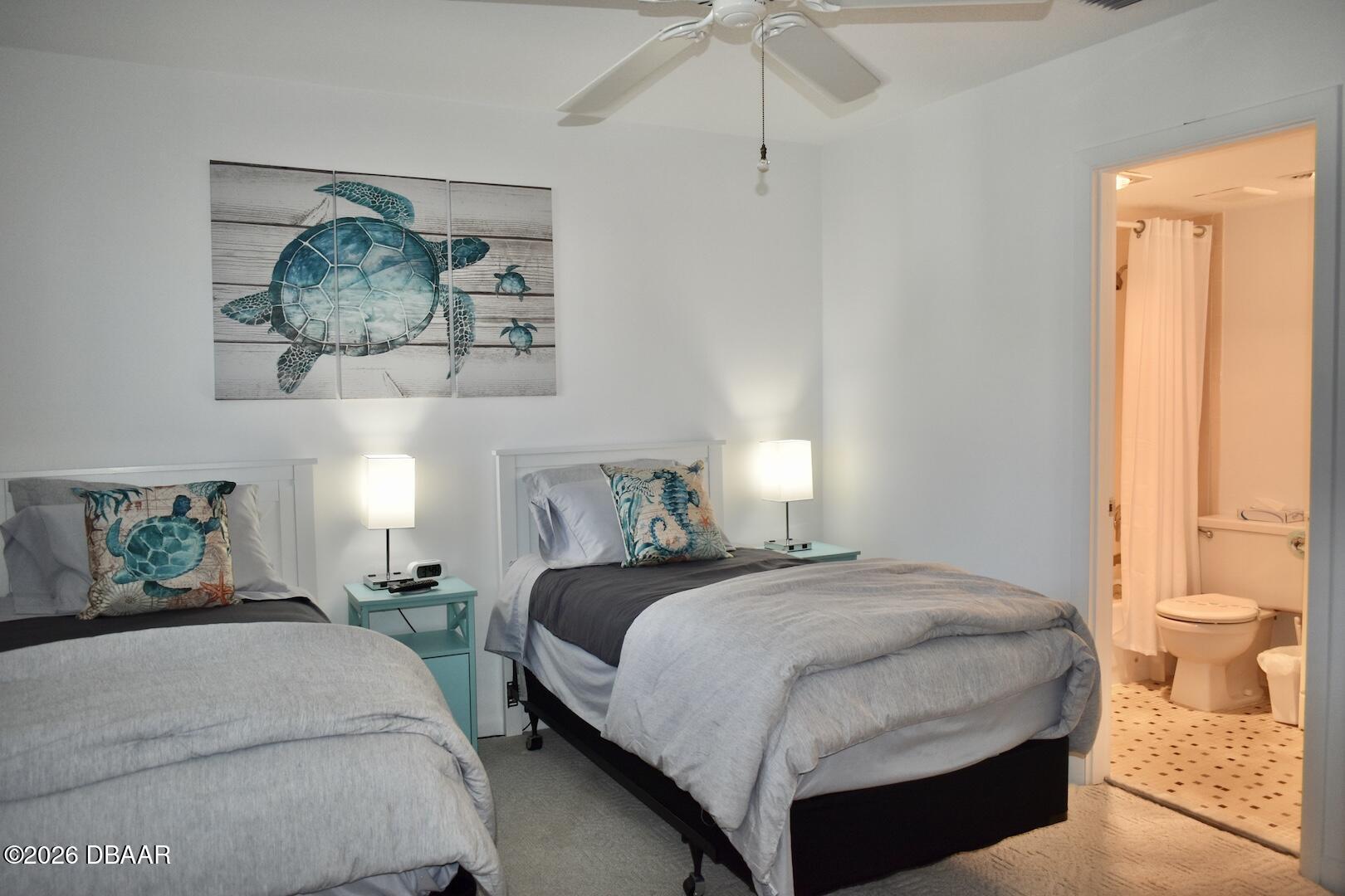 4790 South Atlantic Avenue, Unit F602 Ponce Inlet, FL 32127 - Photo 13 of 23 a bedroom with a bed and a painting on the wall