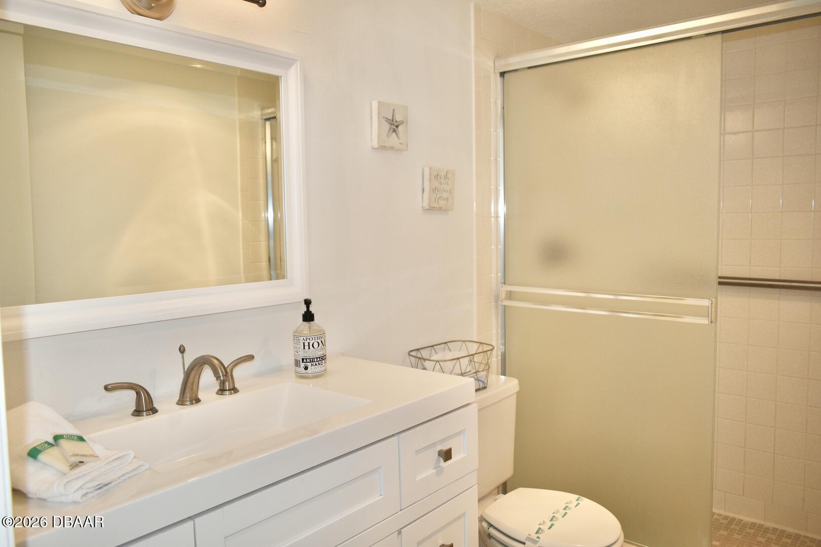 4790 South Atlantic Avenue, Unit F602 Ponce Inlet, FL 32127 - Photo 20 of 23 a bathroom with a sink a toilet and shower