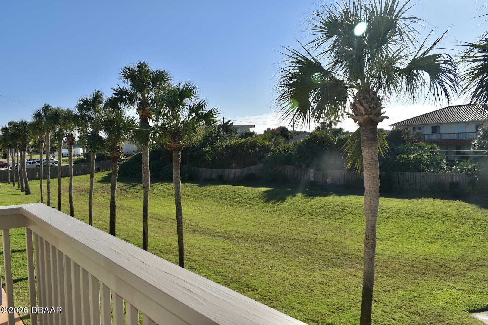 4790 South Atlantic Avenue, Unit F602 Ponce Inlet, FL 32127 - Photo 22 of 23 a view of a swimming pool with a garden