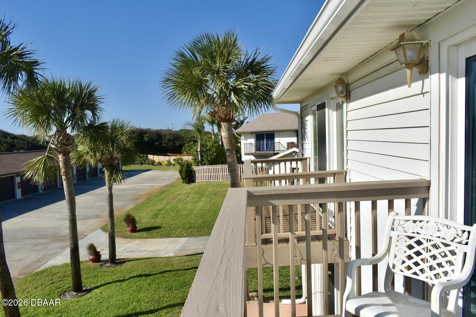 4790 South Atlantic Avenue, Unit F602 Ponce Inlet, FL 32127 - Photo 23 of 23 a view of a house with backyard and porch