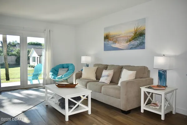 a living room with furniture and a window