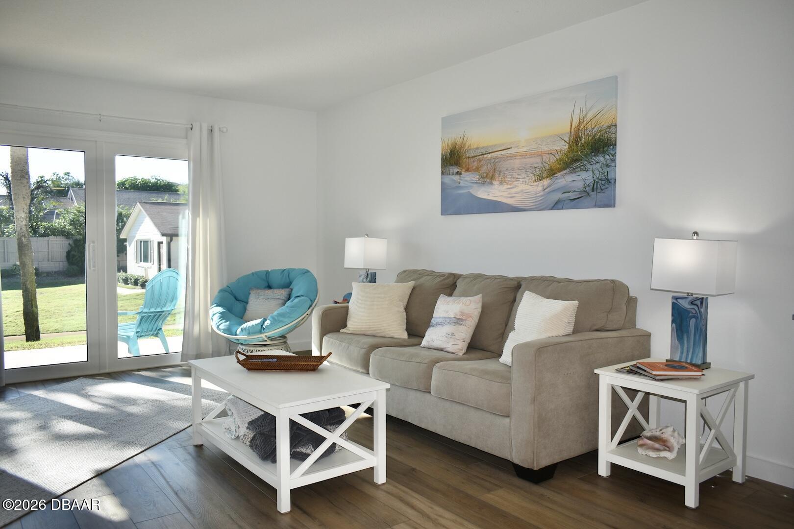 4790 South Atlantic Avenue, Unit F602 Ponce Inlet, FL 32127 - Photo 4 of 23 a living room with furniture and a window