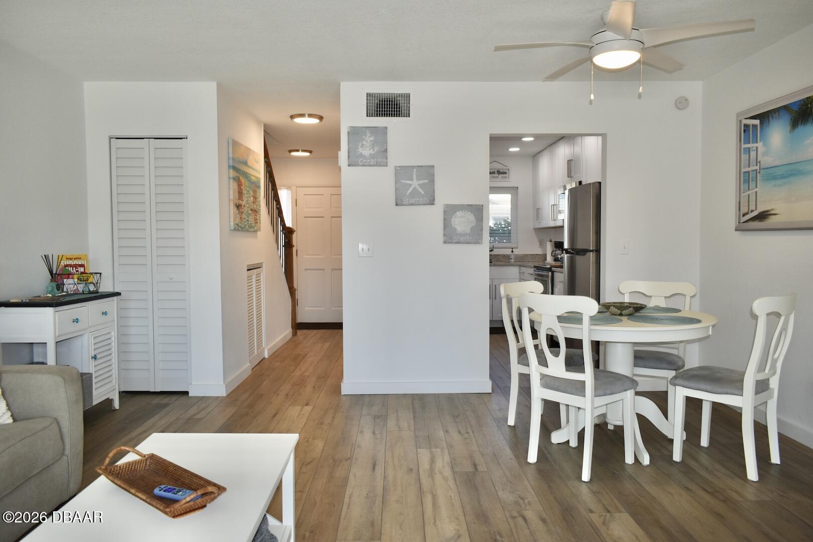 4790 South Atlantic Avenue, Unit F602 Ponce Inlet, FL 32127 - Photo 6 of 23 a view of a dining room with furniture and wooden floor