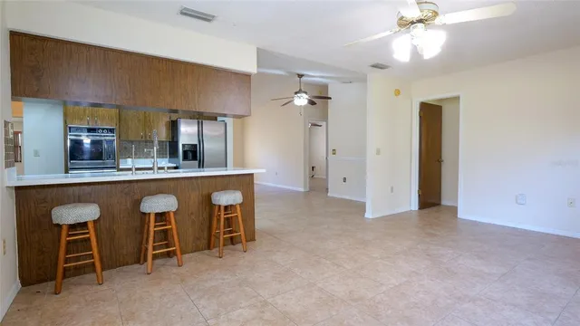 a view of an empty room with windows