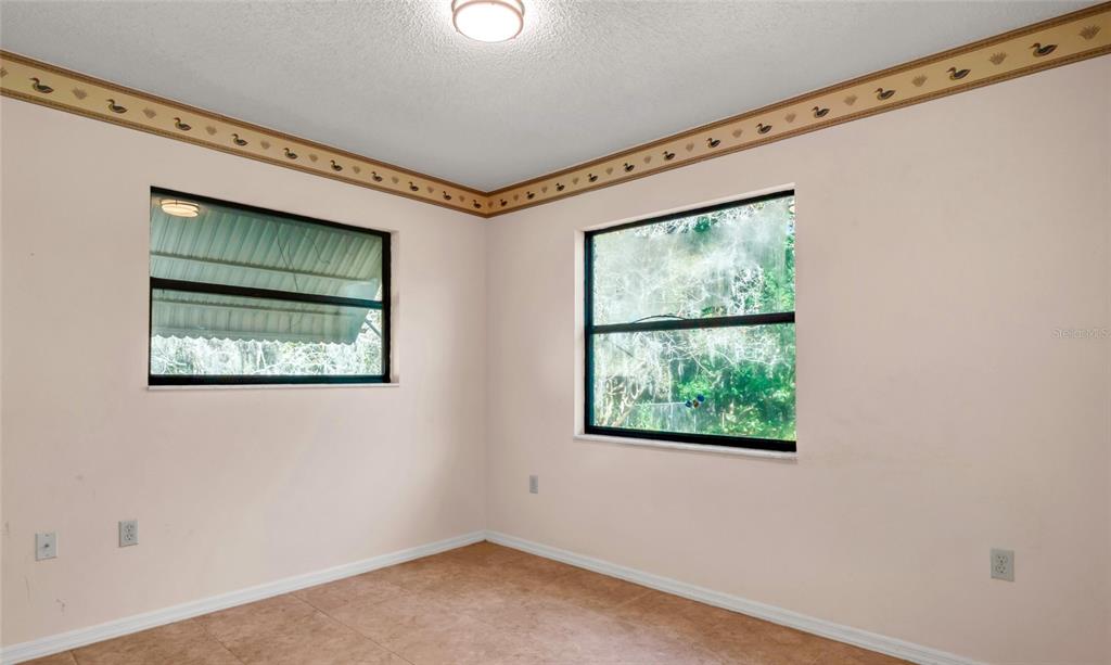 10960 Echo Loop New Port Richey, FL 34654 - Photo 18 of 38 a view of an empty room with a window