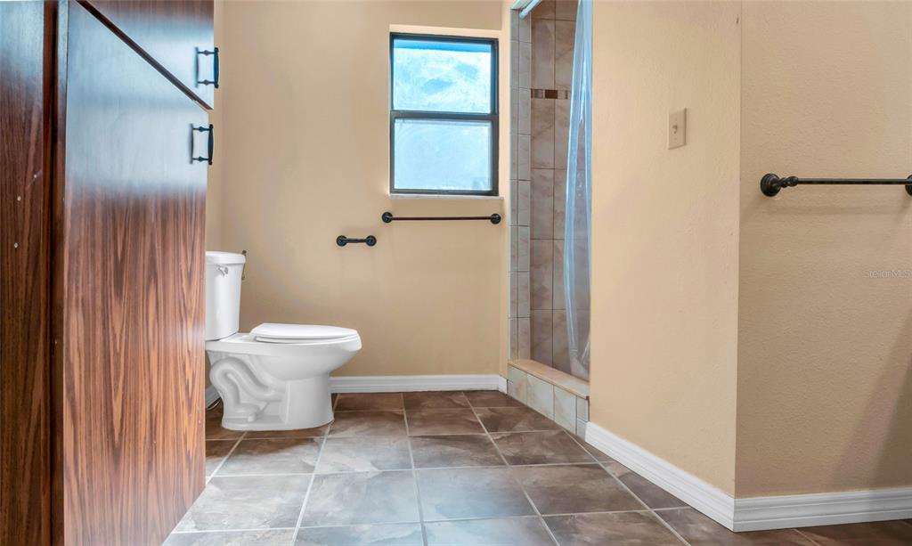 10960 Echo Loop New Port Richey, FL 34654 - Photo 20 of 38 a bathroom with a toilet