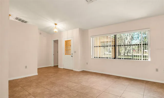 a view of an empty room with a window