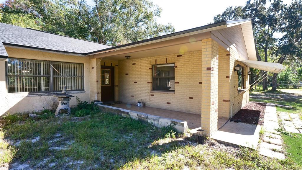 10960 Echo Loop New Port Richey, FL 34654 - Photo 32 of 38 a view of a house with backyard and garden