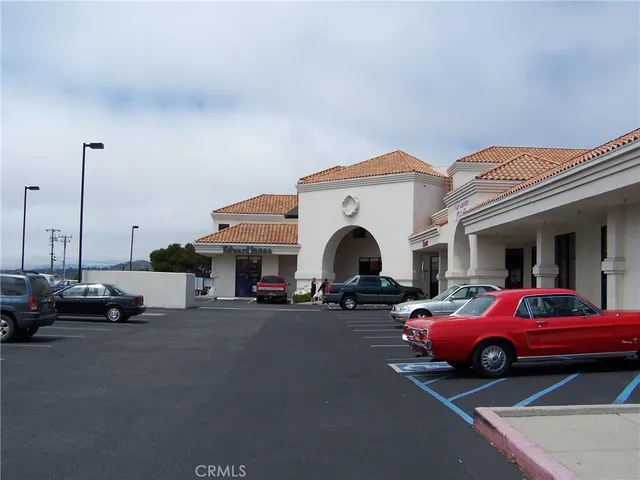 a view of a cars is parked in front of a house