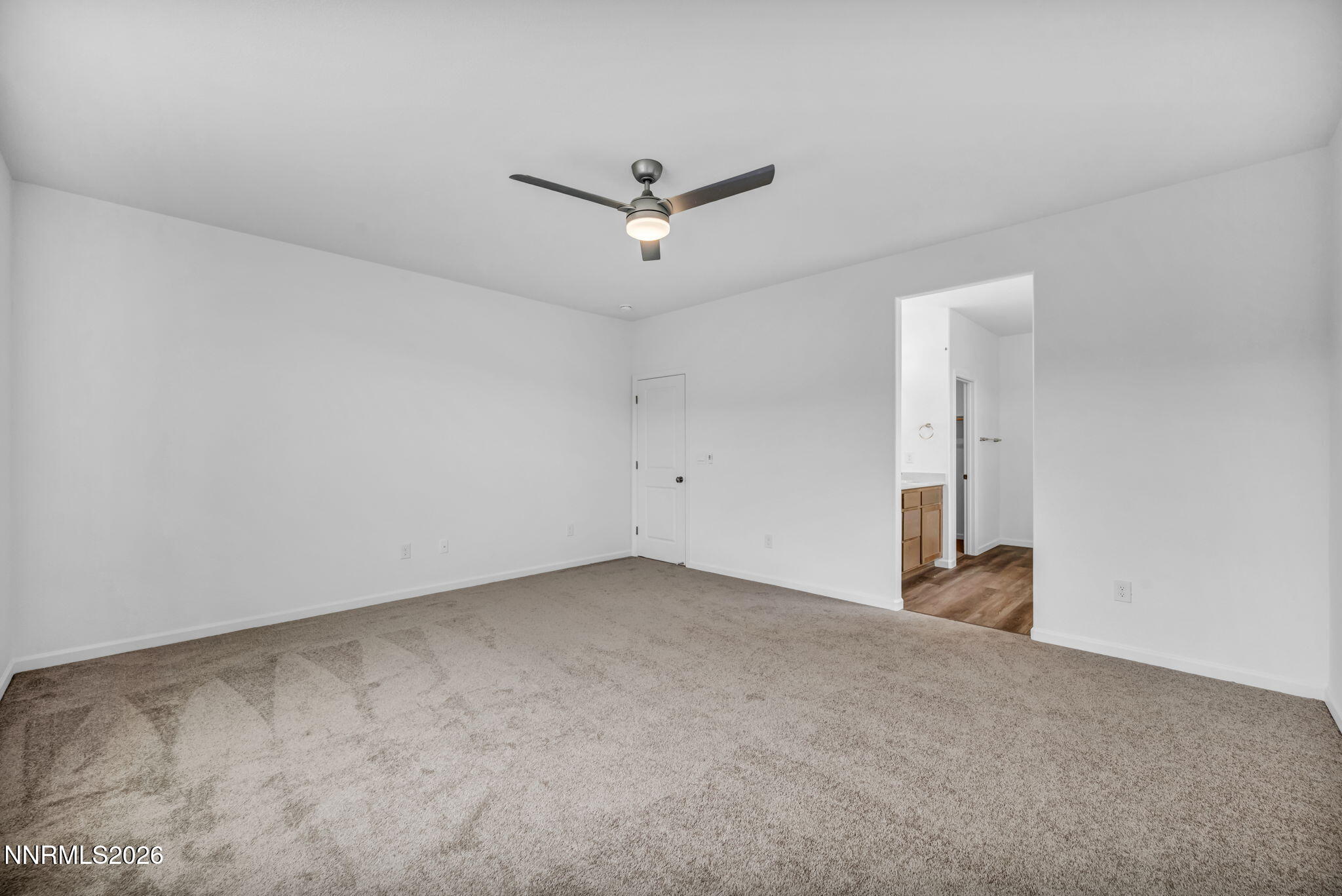 6663 Morgan Mill Road, Unit HOMESITE 44 Carson City, NV 89701 - Photo 11 of 26 an empty room with a ceiling fan and window