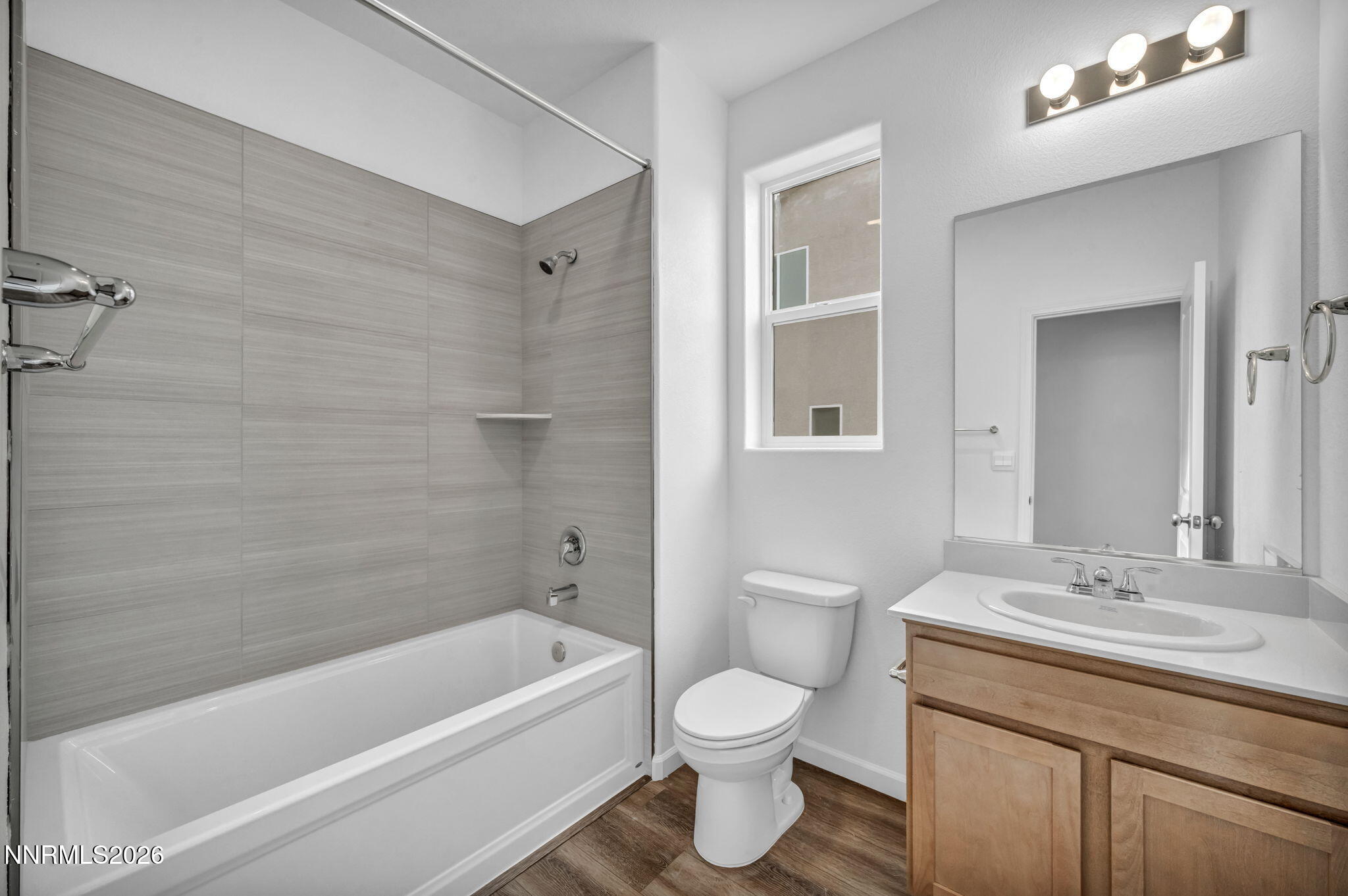 6663 Morgan Mill Road, Unit HOMESITE 44 Carson City, NV 89701 - Photo 19 of 26 a bathroom with a granite countertop sink a toilet and bathtub