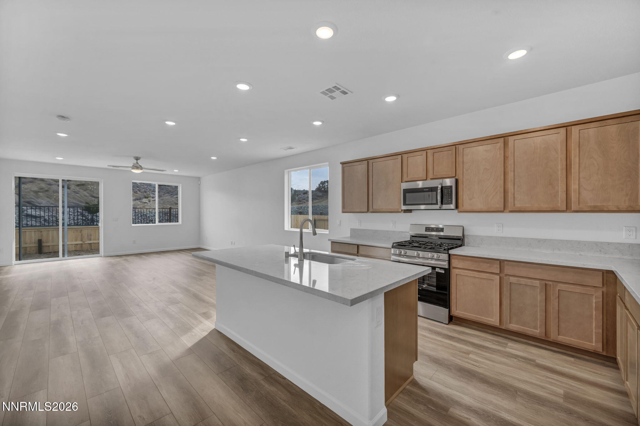 6663 Morgan Mill Road, Unit HOMESITE 44 Carson City, NV 89701 - Photo 2 of 26 a kitchen with stainless steel appliances granite countertop a sink stove and refrigerator