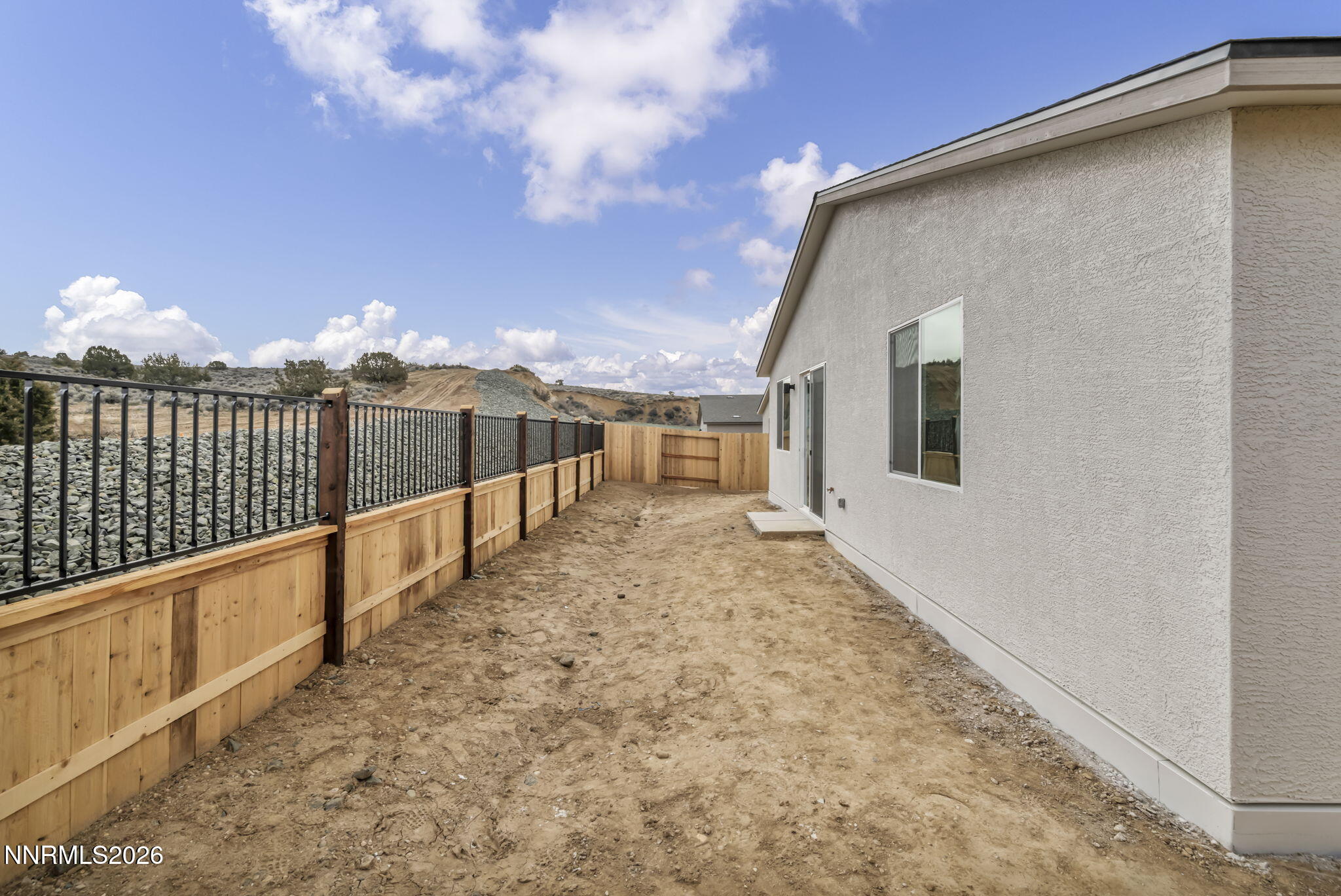 6663 Morgan Mill Road, Unit HOMESITE 44 Carson City, NV 89701 - Photo 22 of 26 a view of a house with a backyard