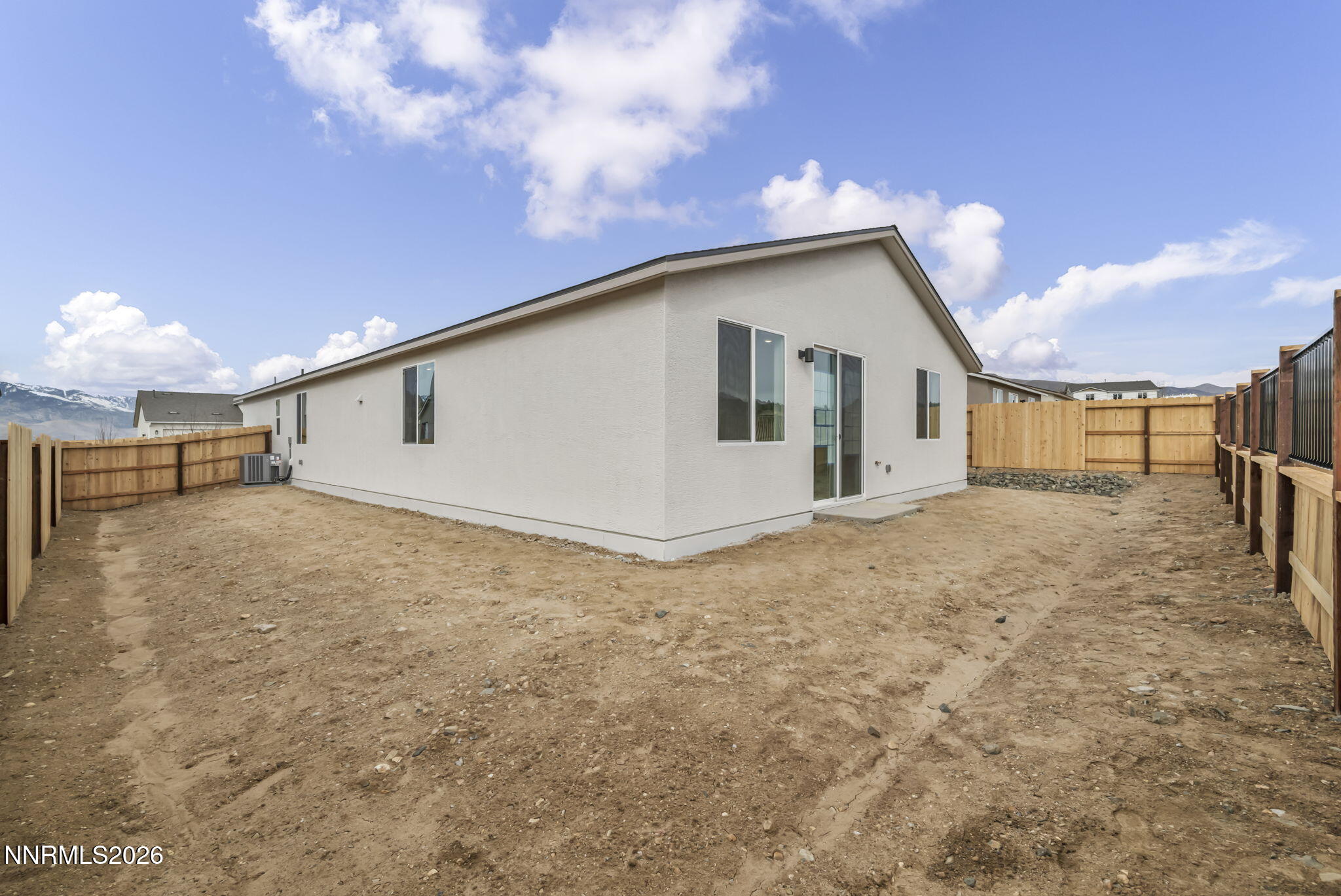 6663 Morgan Mill Road, Unit HOMESITE 44 Carson City, NV 89701 - Photo 24 of 26 a view of a house with a backyard