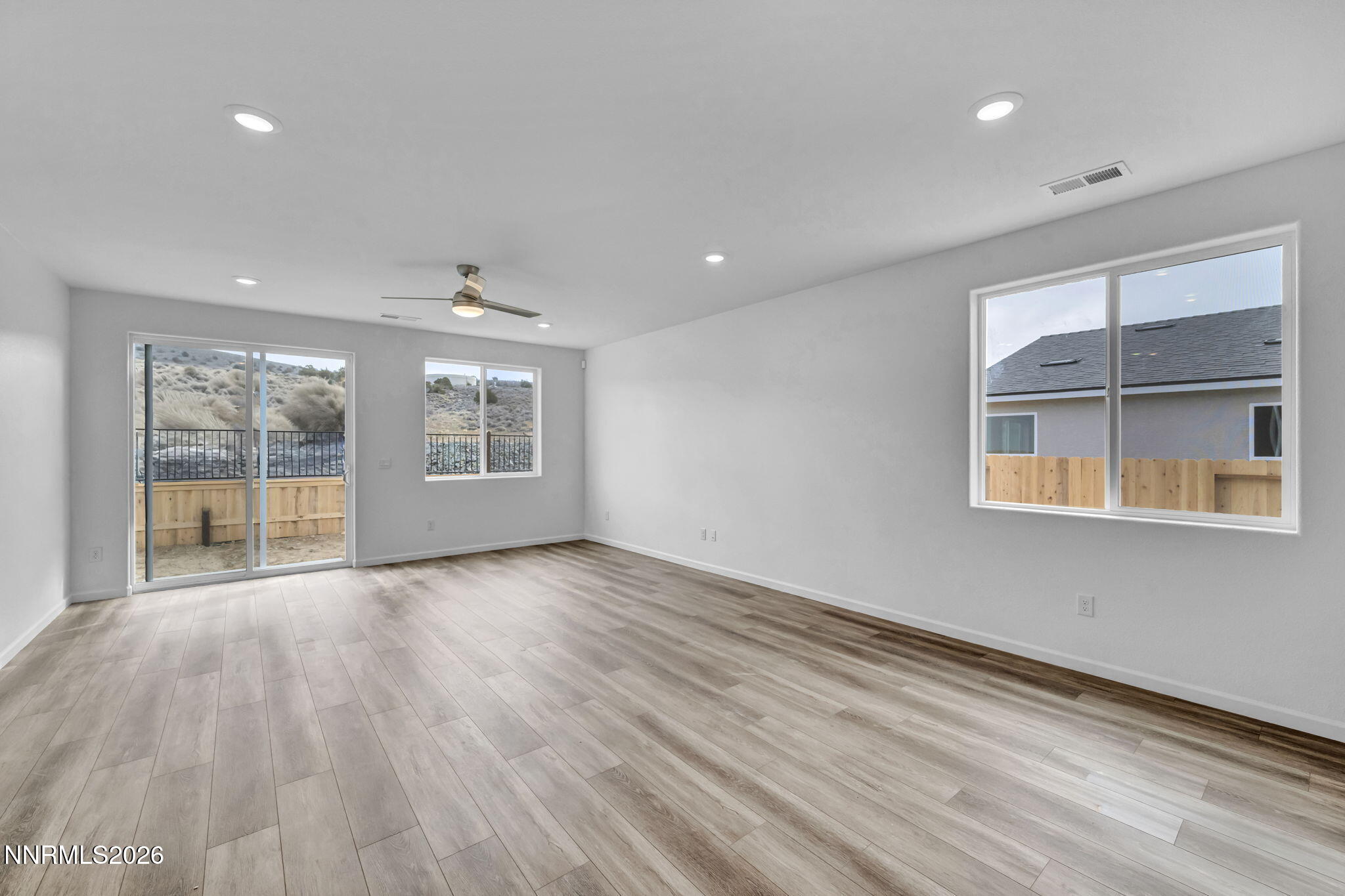 6663 Morgan Mill Road, Unit HOMESITE 44 Carson City, NV 89701 - Photo 7 of 26 a view of an empty room with a window and wooden floor